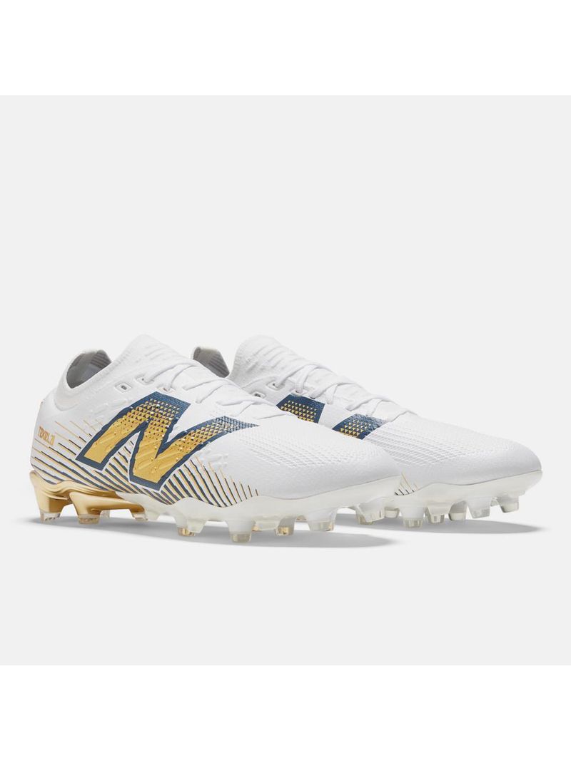 Chuteira campo new balance tekela pro low fg v4+ unisex